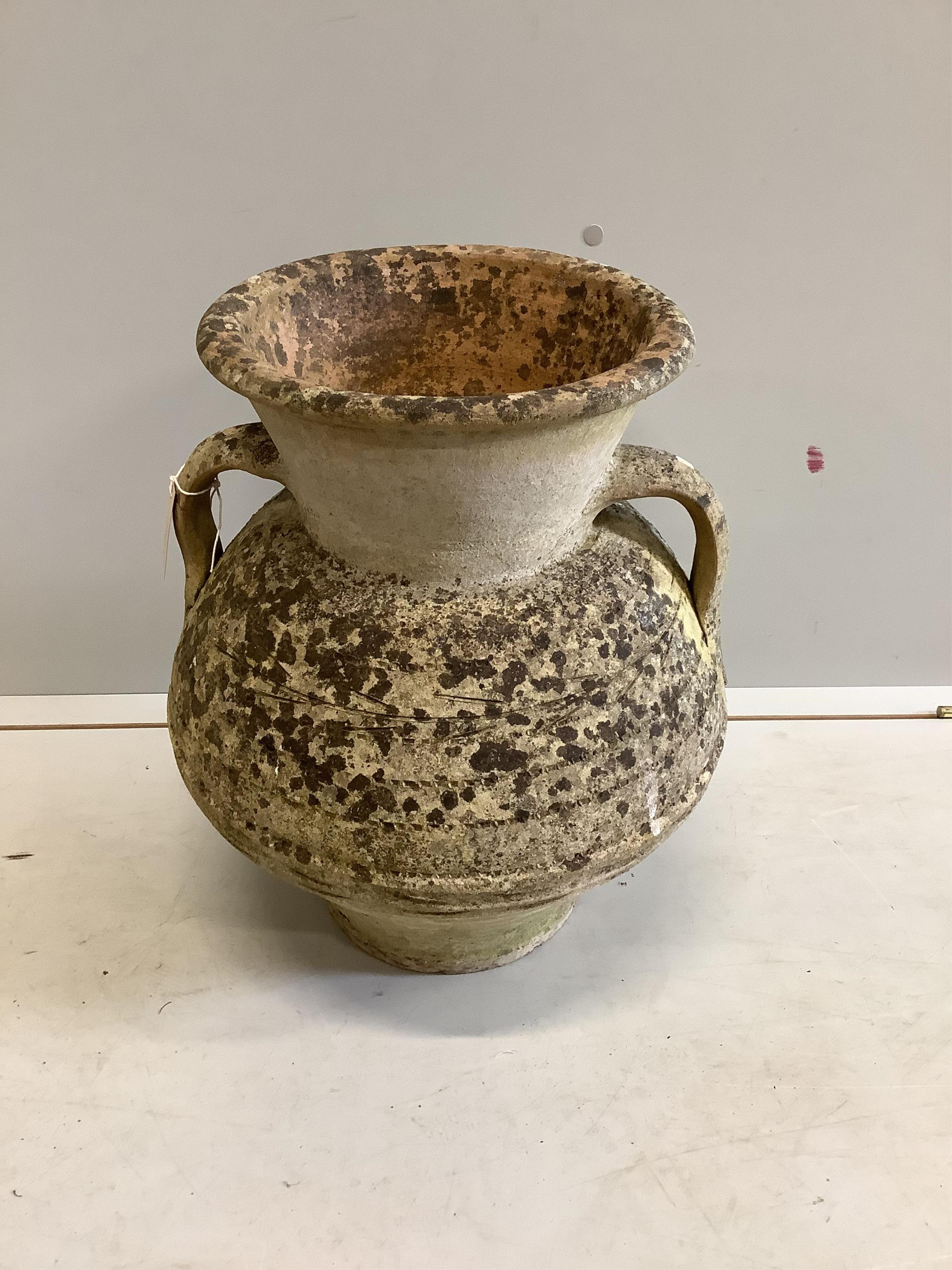 An earthenware amphora, height 48cm. Condition - fair